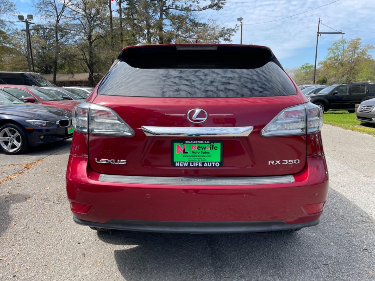 2010 RED LEXUS RX 350 BASE (2T2ZK1BAXAC) with an 3.5L engine, Automatic transmission, located at 5103 Dorchester Rd., Charleston, SC, 29418-5607, (843) 767-1122, 36.245171, -115.228050 - Super clean interior with Leather, Sunroof, 6-disc CD/AUX/Sat, hands-free Phone, Dual Climate Control, Power Everything (windows, locks, seats, mirrors), Heated/Cooled/Memory Seating, Push Button Start, Keyless Entry, Alloy Wheels. Clean CarFax (no accidents reported!) 108k miles Located at New Lif - Photo#5